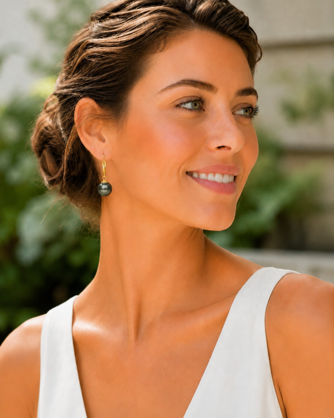 Close-up of 8.5–9mm round Tahitian pearl leverback earrings