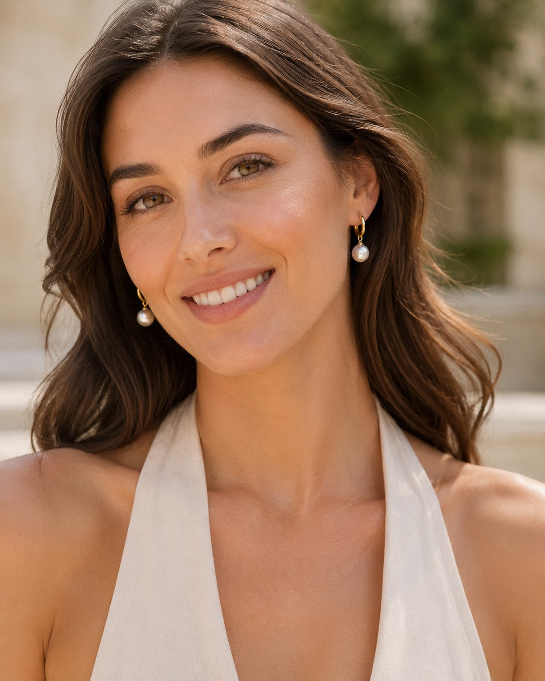 Close-up of 8.5–9mm white South Sea pearl huggie earrings