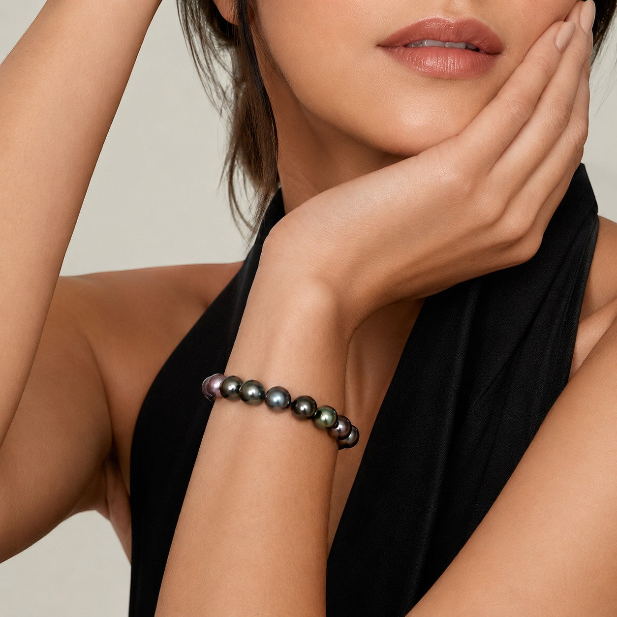 Prestige Pearl multicolor Tahitian pearl bracelet with 9-10mm round pearls on a model wearing a black top
