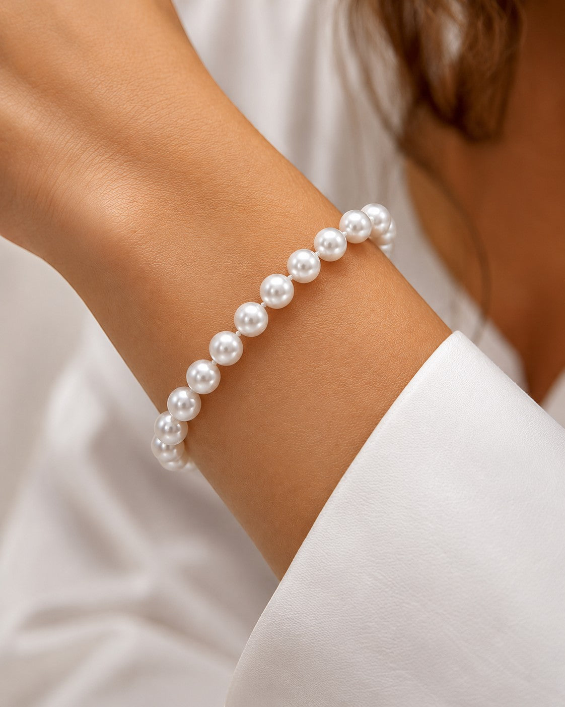Prestige Pearl hand-knotted bracelet featuring 5.5-6mm round white Akoya pearls worn on a wrist