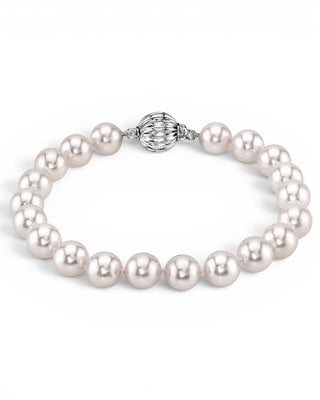 Prestige Pearl 7-7.5mm white Akoya pearl bracelet with a round filigree 14KT white gold clasp on a white background.