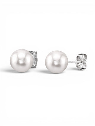 Prestige Pearl 7-7.5mm round white Akoya pearl stud earrings with secure gold butterfly backs on a white background.
