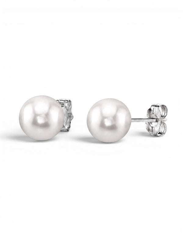 Prestige Pearl 7-7.5mm round white Akoya pearl stud earrings with secure gold butterfly backs on a white background.